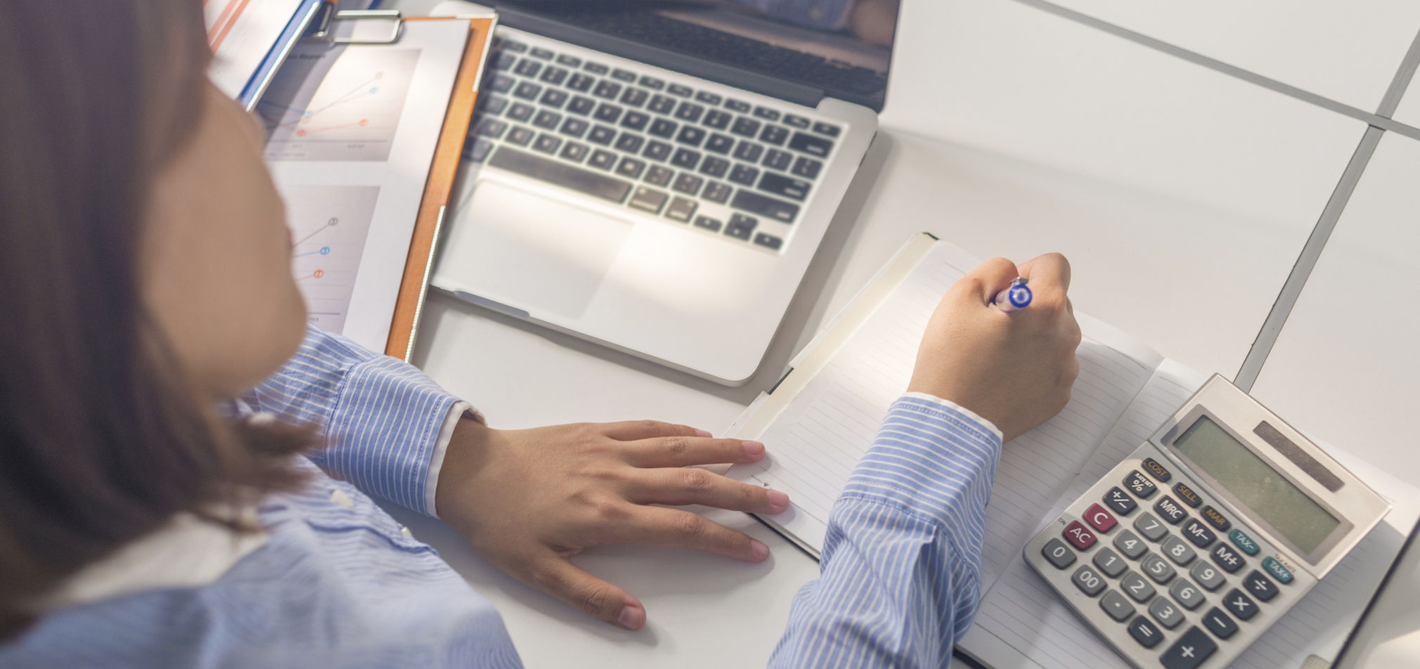 Female accountant doing her daily job at office